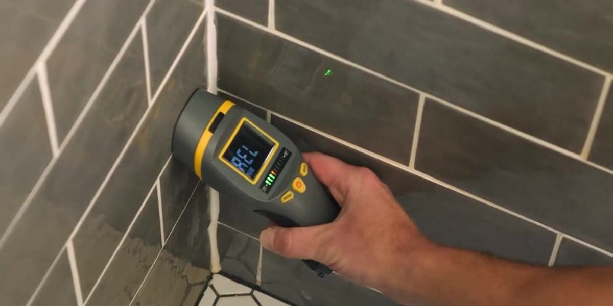 A moisture meter is a small, handheld tool that measures the amount of water hiding behind your bathroom walls, under your flooring, or around your tub or shower